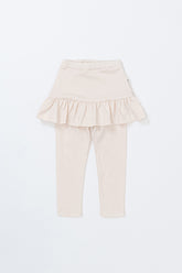 Avauma milky white baby skirt leggings laid flat, featuring delicate ruffle details – trendy and cozy infant outfit